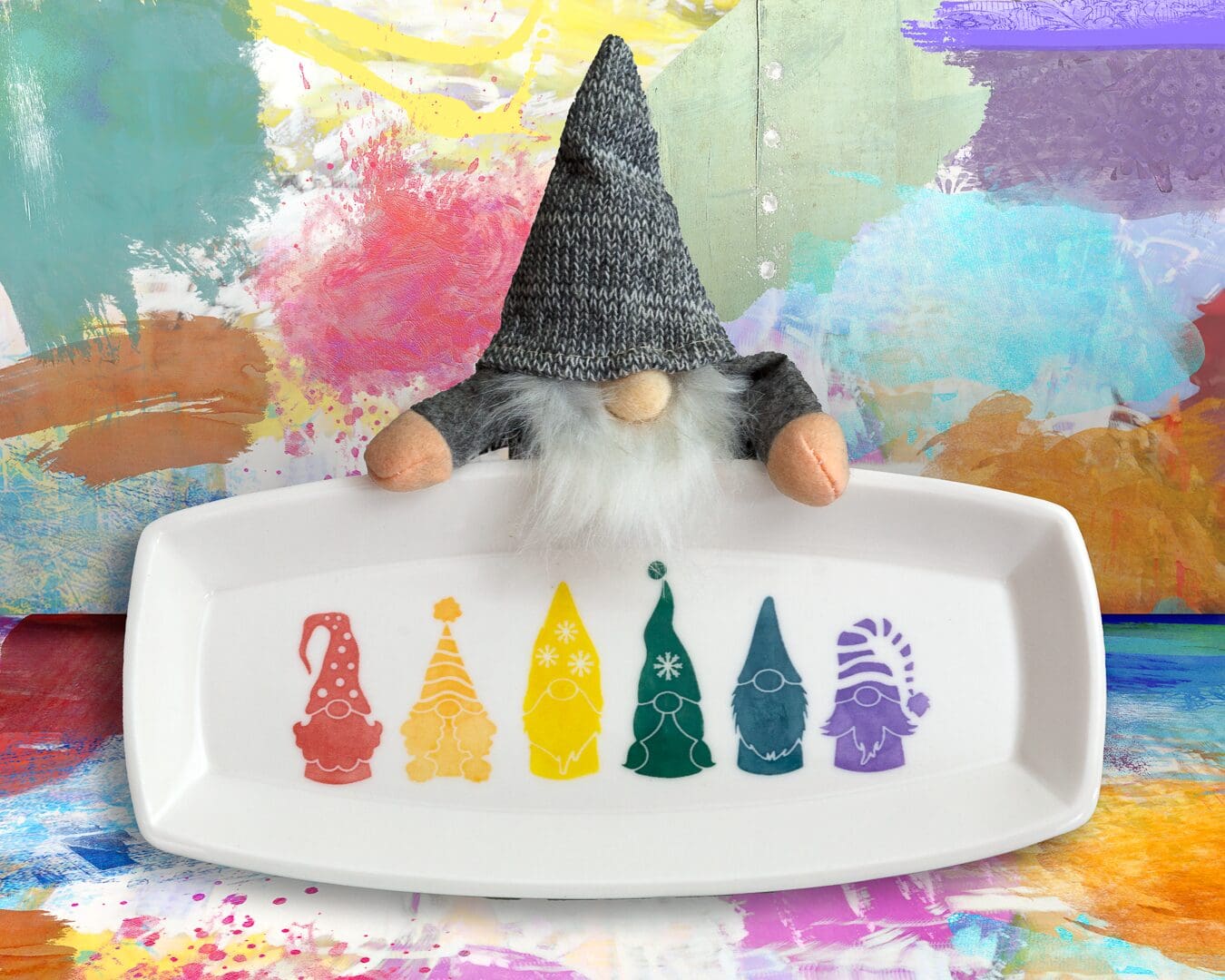 A gnome sitting on top of a plate.